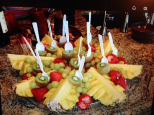 Create a beautiful fruit tray w pineapple, strawberries, grapes & kiwi.
